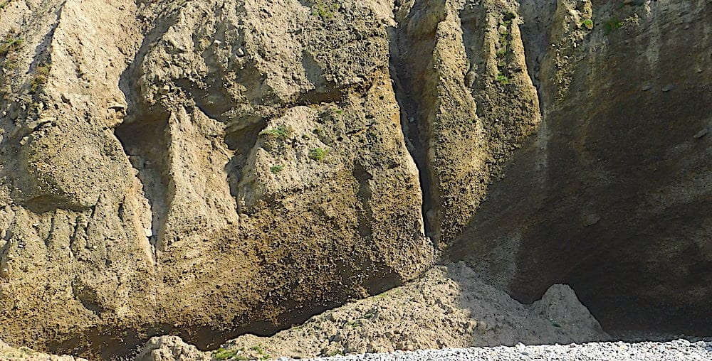 The cliff face by the Lleyn shear zone at Aberdaron. This material predates the glacial outwash material forming the rest of the cliffs on the Eastern side of Aberdaron beach.