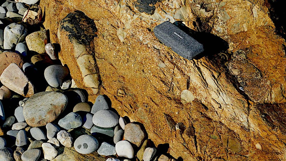 An ash deposit with a large volcanic bomb on the beach North of Llanbedrog. (Scale is a spectacles case.)